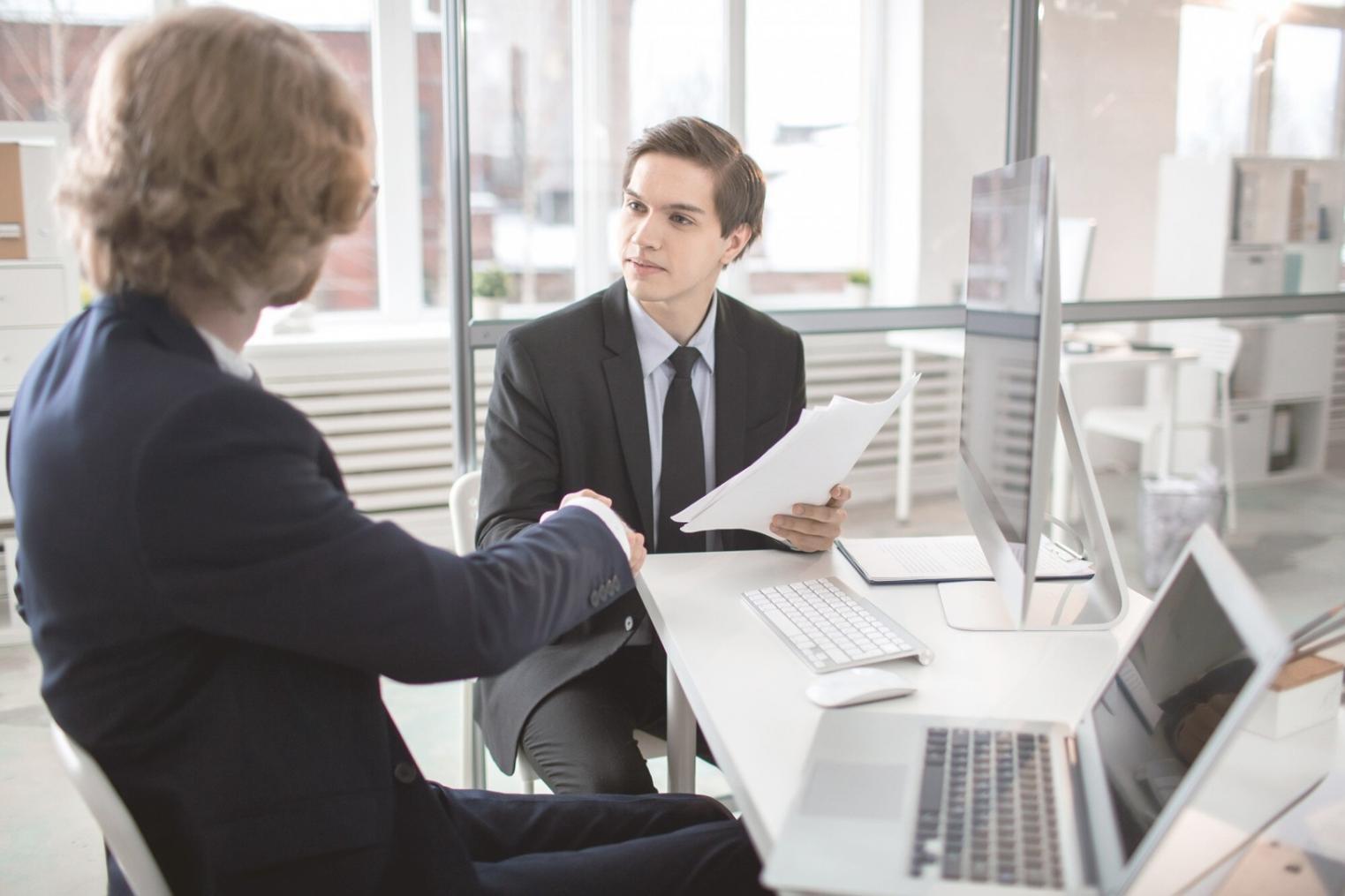 Business meeting with financial documents and calculators