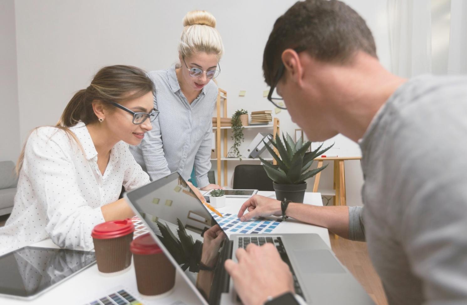 Professional meeting room with financial documents and collaboration